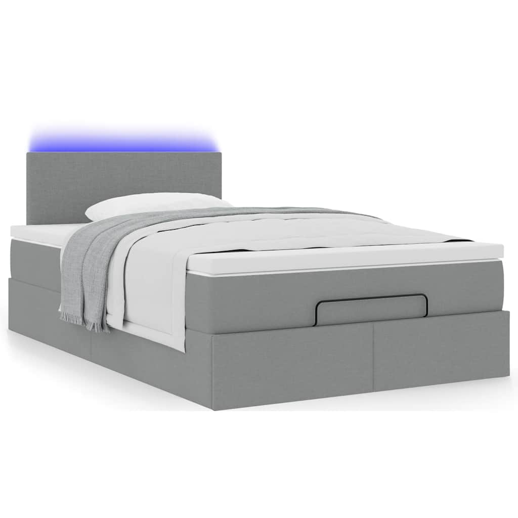 Ottoman bed met matras en LED's 120x190 cm stof lichtgrijs