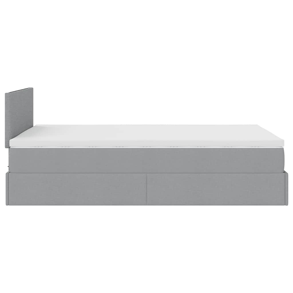 Ottoman bed met matras en LED's 120x190 cm stof lichtgrijs