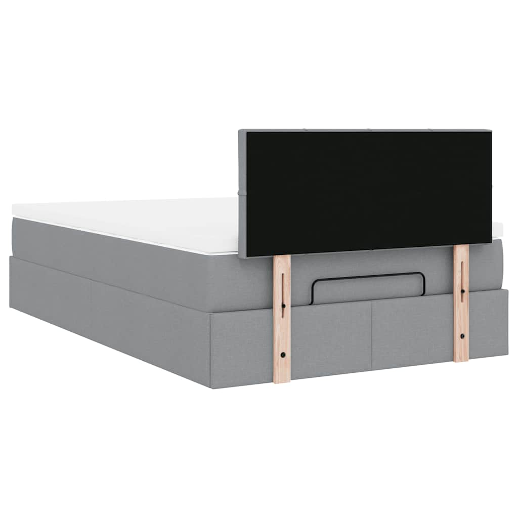 Ottoman bed met matras en LED's 120x190 cm stof lichtgrijs