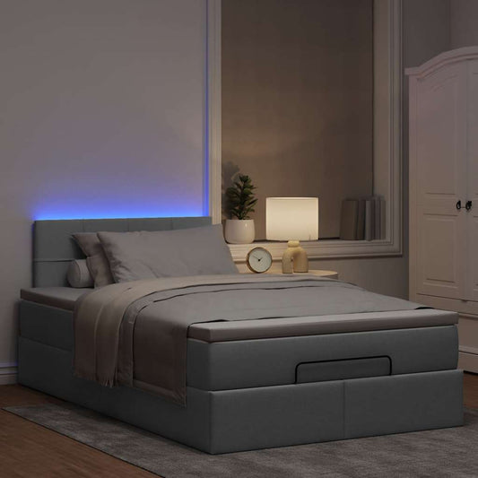 Ottoman bed met matras en LED's 120x190 cm stof lichtgrijs