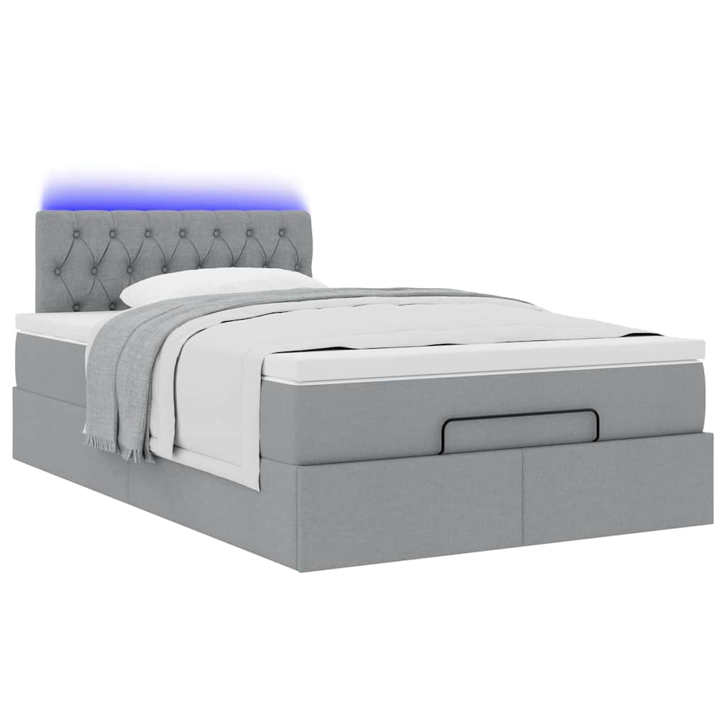 Ottoman bed met matras en LED's 120x190 cm stof lichtgrijs