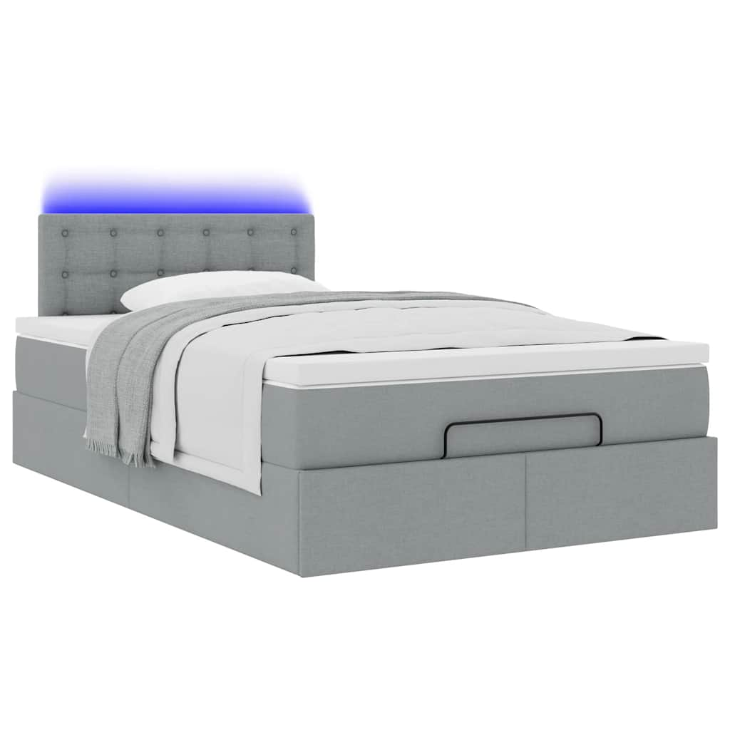 Ottoman bed met matras en LED's 120x190 cm stof lichtgrijs