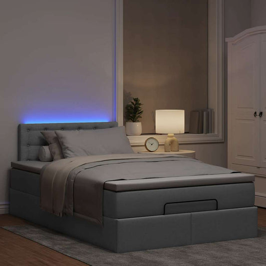 Ottoman bed met matras en LED's 120x190 cm stof lichtgrijs