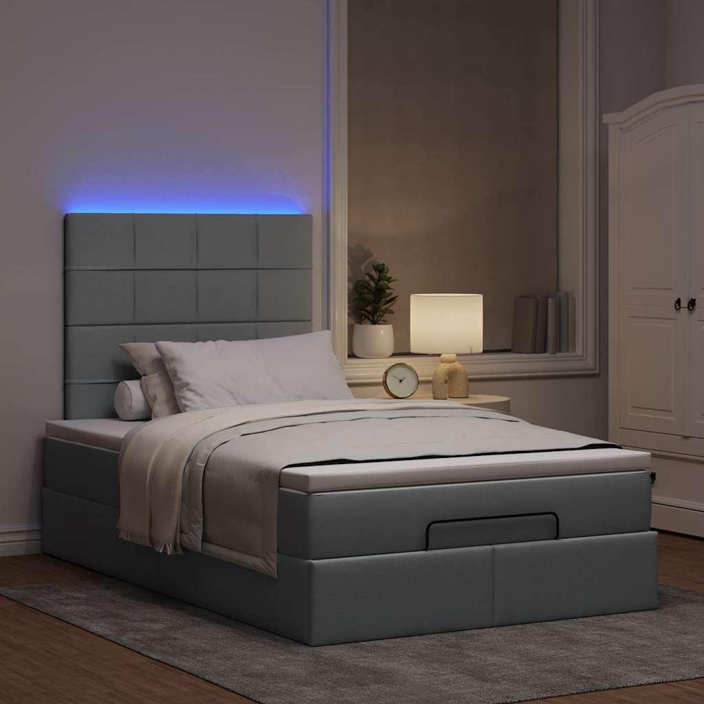 Ottoman bed met matras en LED's 120x190 cm stof lichtgrijs