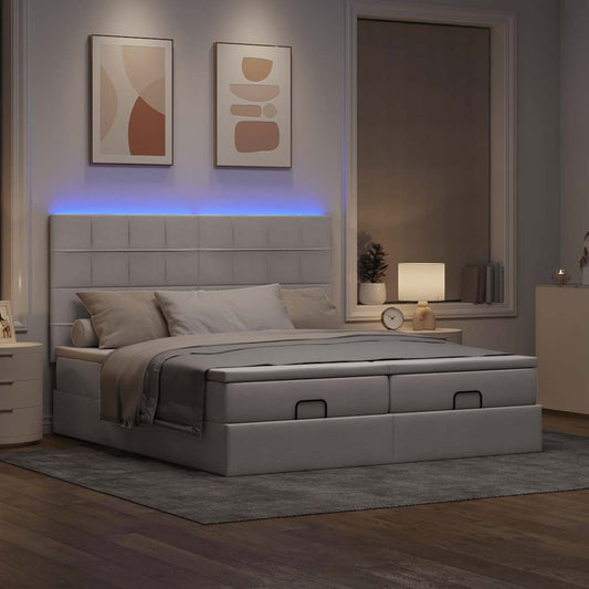 Ottoman bed met matrassen en LED's 200x200cm stof taupe